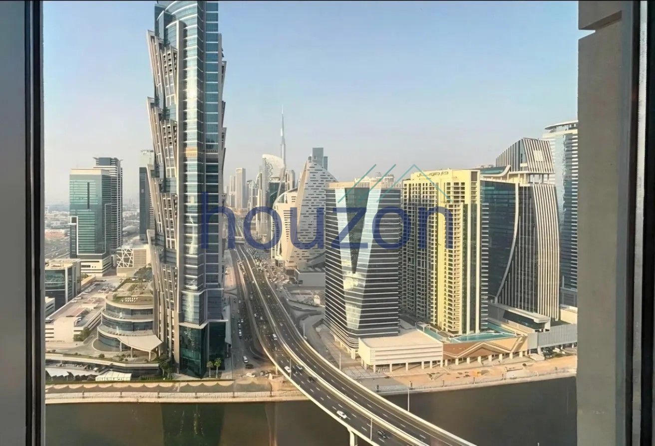 Elegant 2BR | Canal + Sea | Burj View